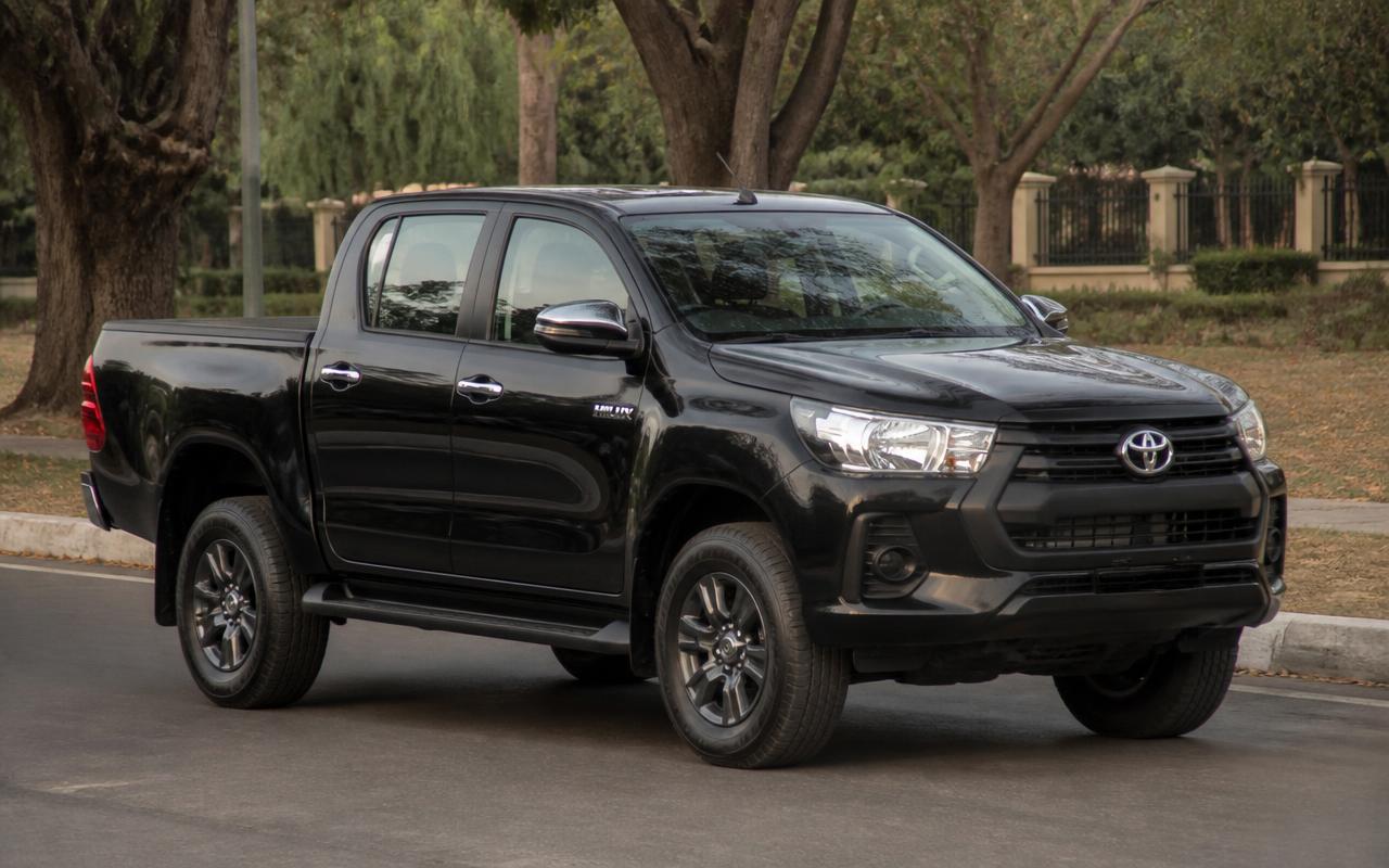 Black Toyota Hilux double-cab pickup parked on a road in Abuja in daylight